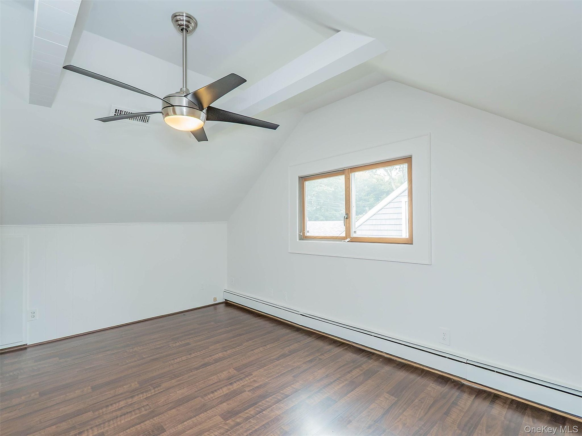 2nd floor: Bedroom #3 showing ceiling fan & window.