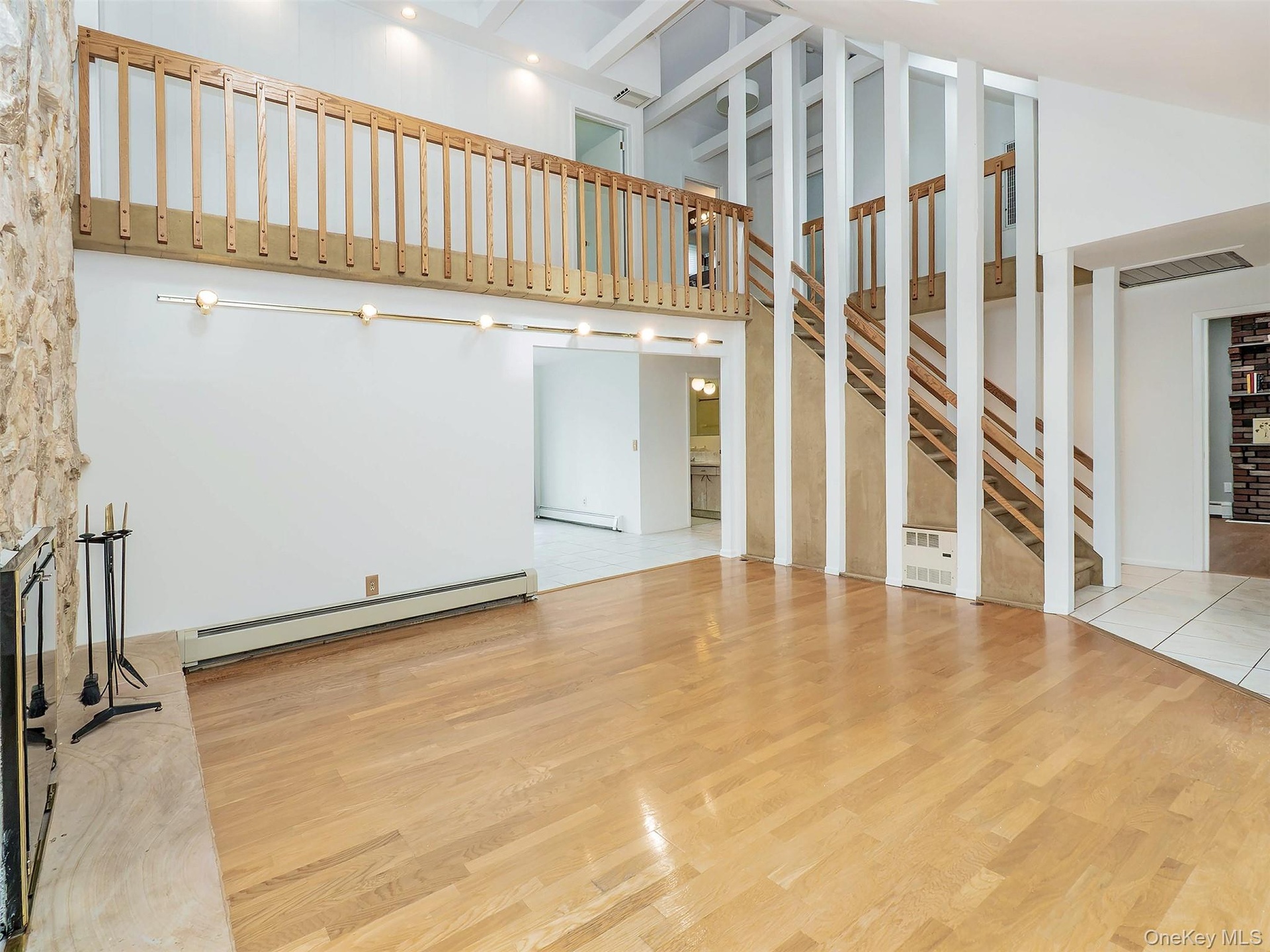 Living room is open to the balcony hallway on the 2nd fl.