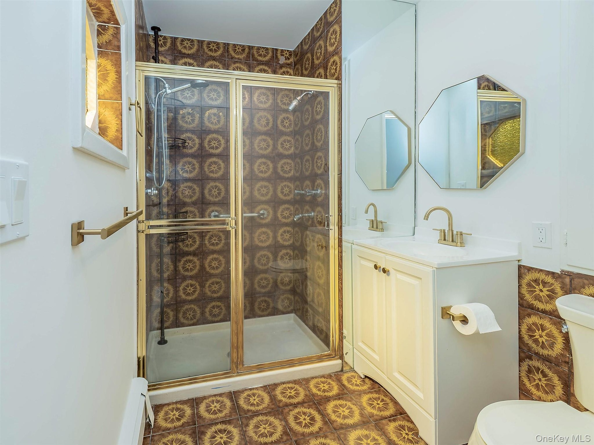 1st floor: Primary bathroom with stall shower and cool 70's tile.