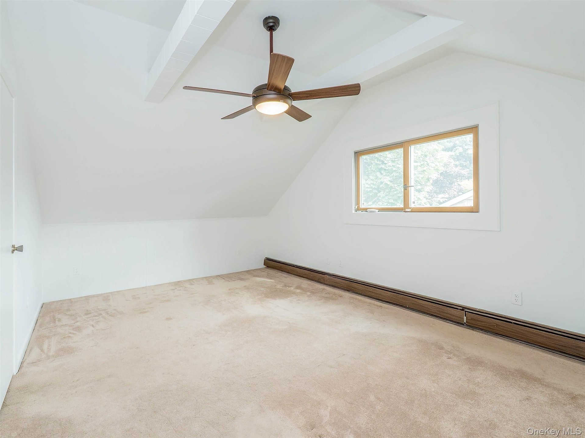 2nd floor: Bedroom #5. Ceiling fan and beams.