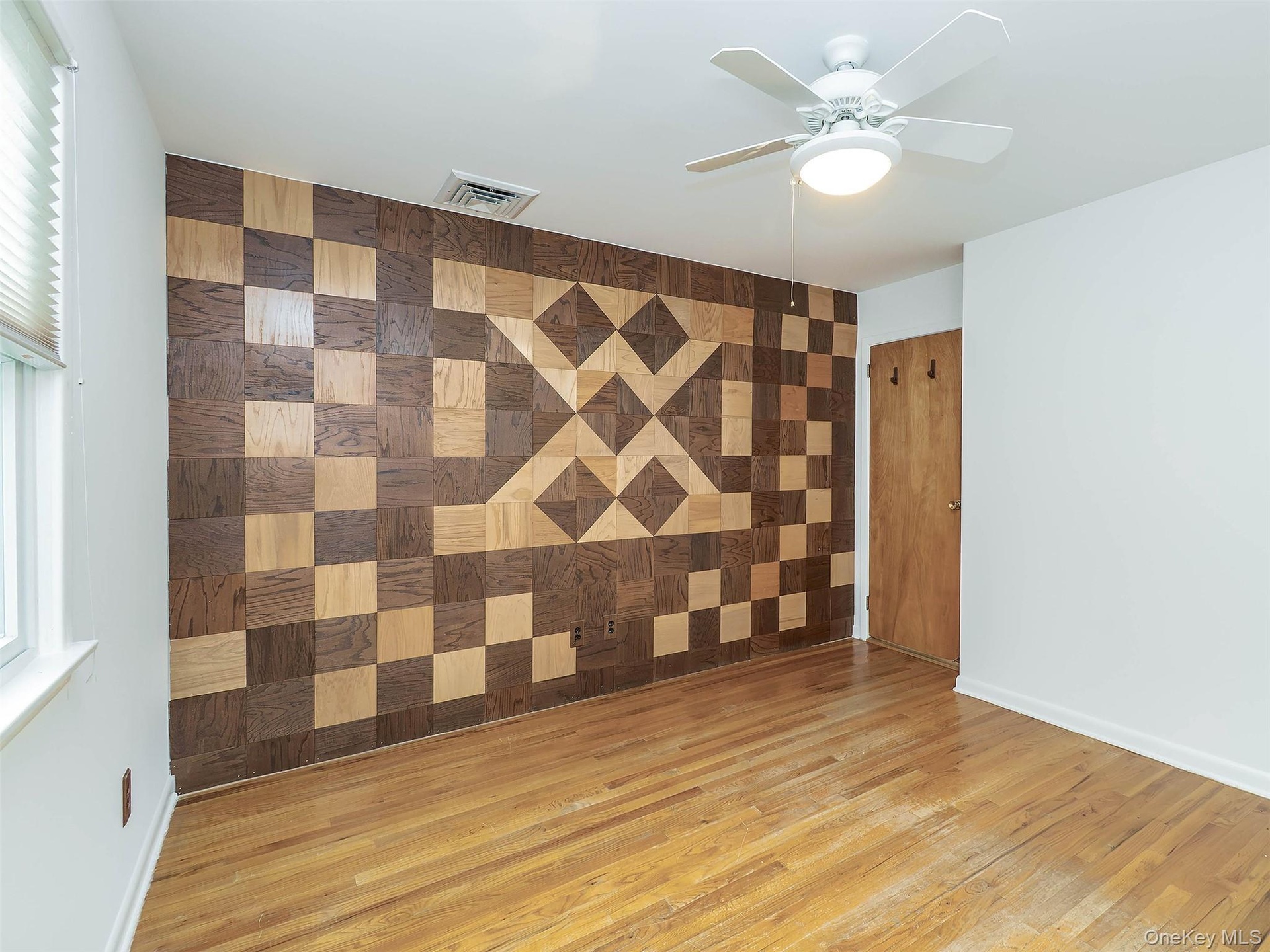 1st floor: bedroom #1 with the wooden inlayed wall.