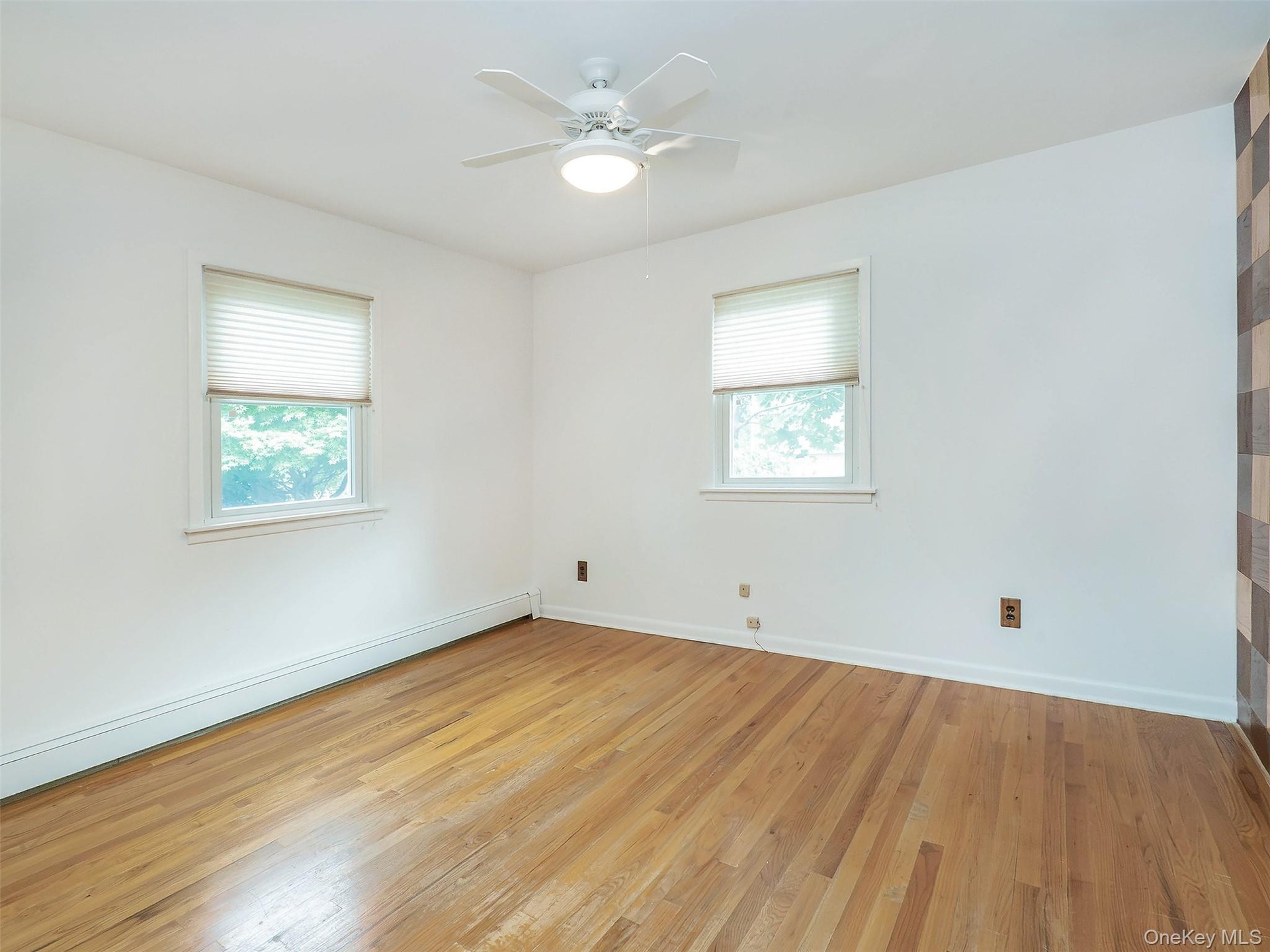 1st floor: bedroom #1 has 2 windows and hardwood floors.