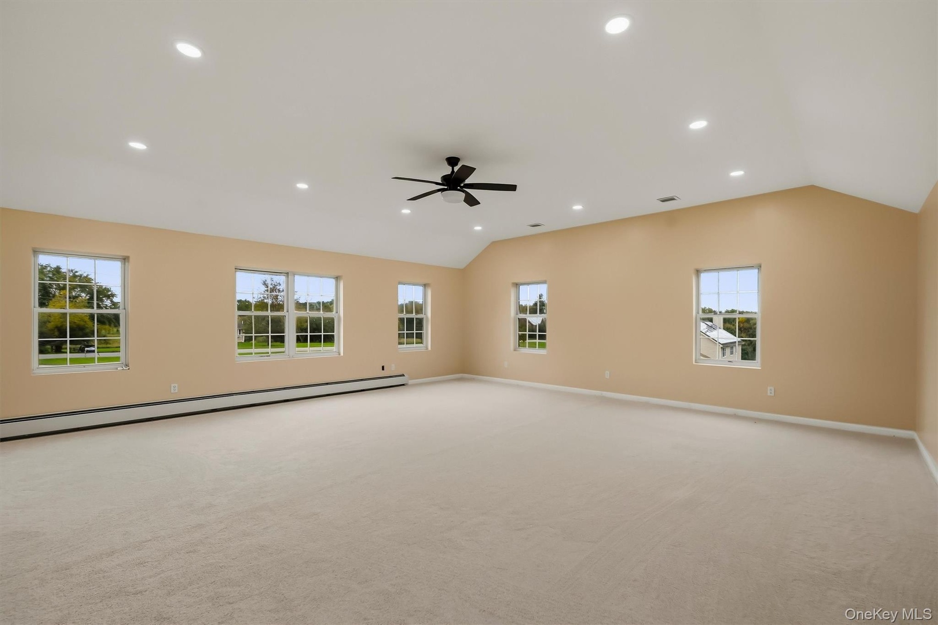 This oversized bonus room opens up a world of possibilities — movie nights, game days, a home gym, or all three.