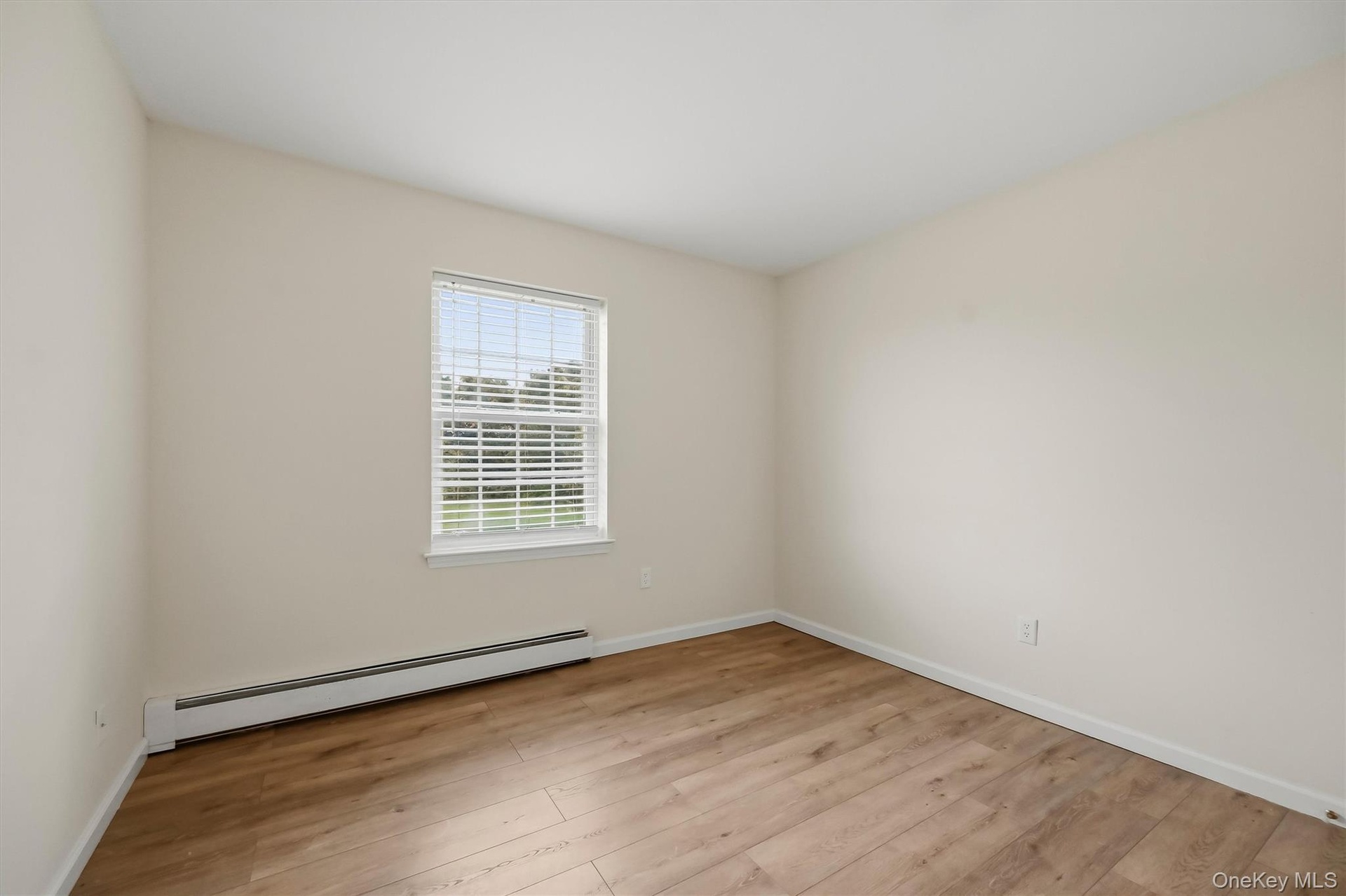 Comfortable secondary bedroom space with the flexibility for family, guests, or a home office.