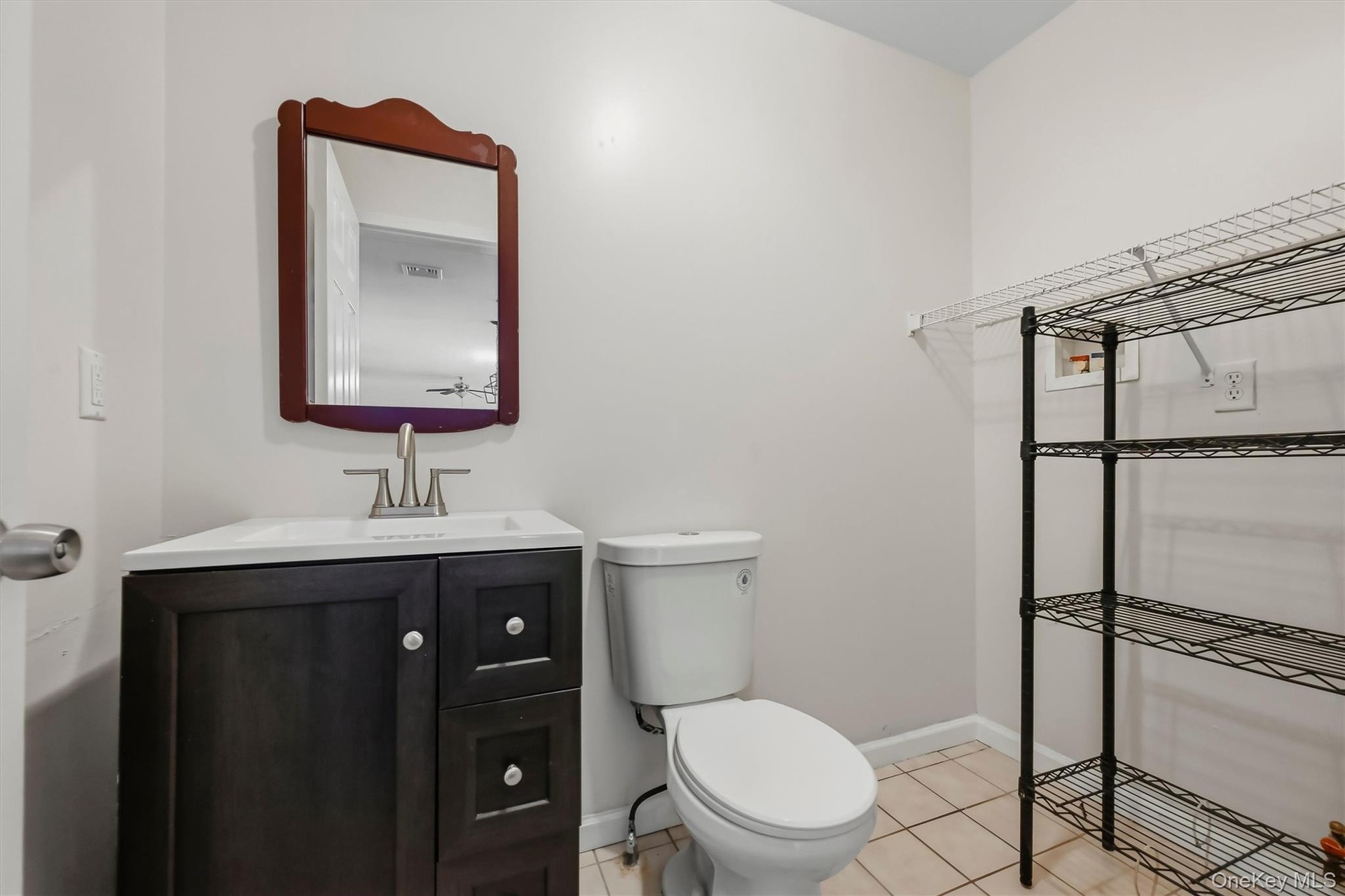Tucked just off the kitchen, the main-level half bath adds everyday convenience without interrupting the home’s flow.