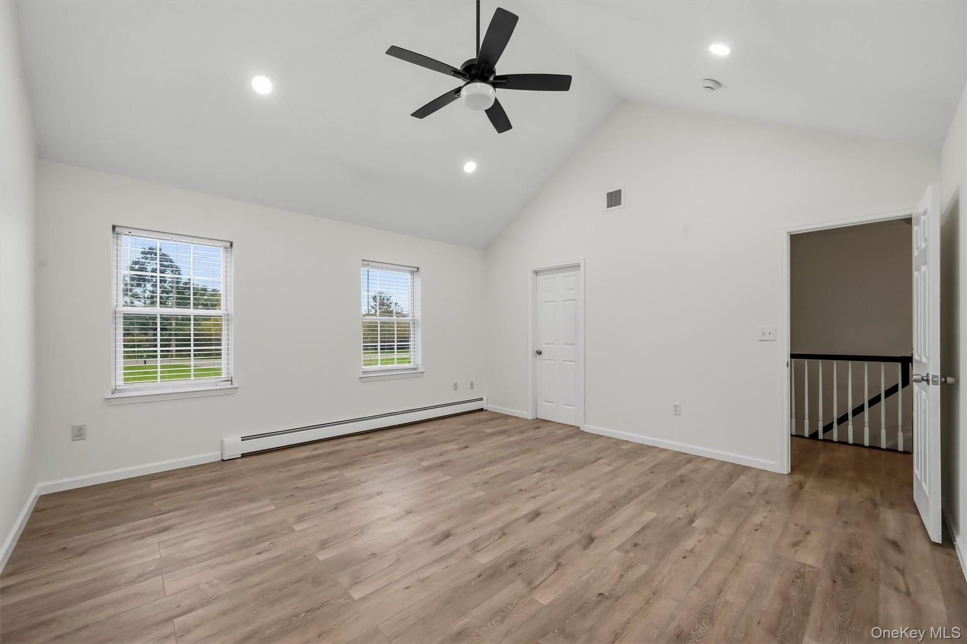 Features a walk in closet, vaulted ceilings, recessed lighting, and plenty of natural light.