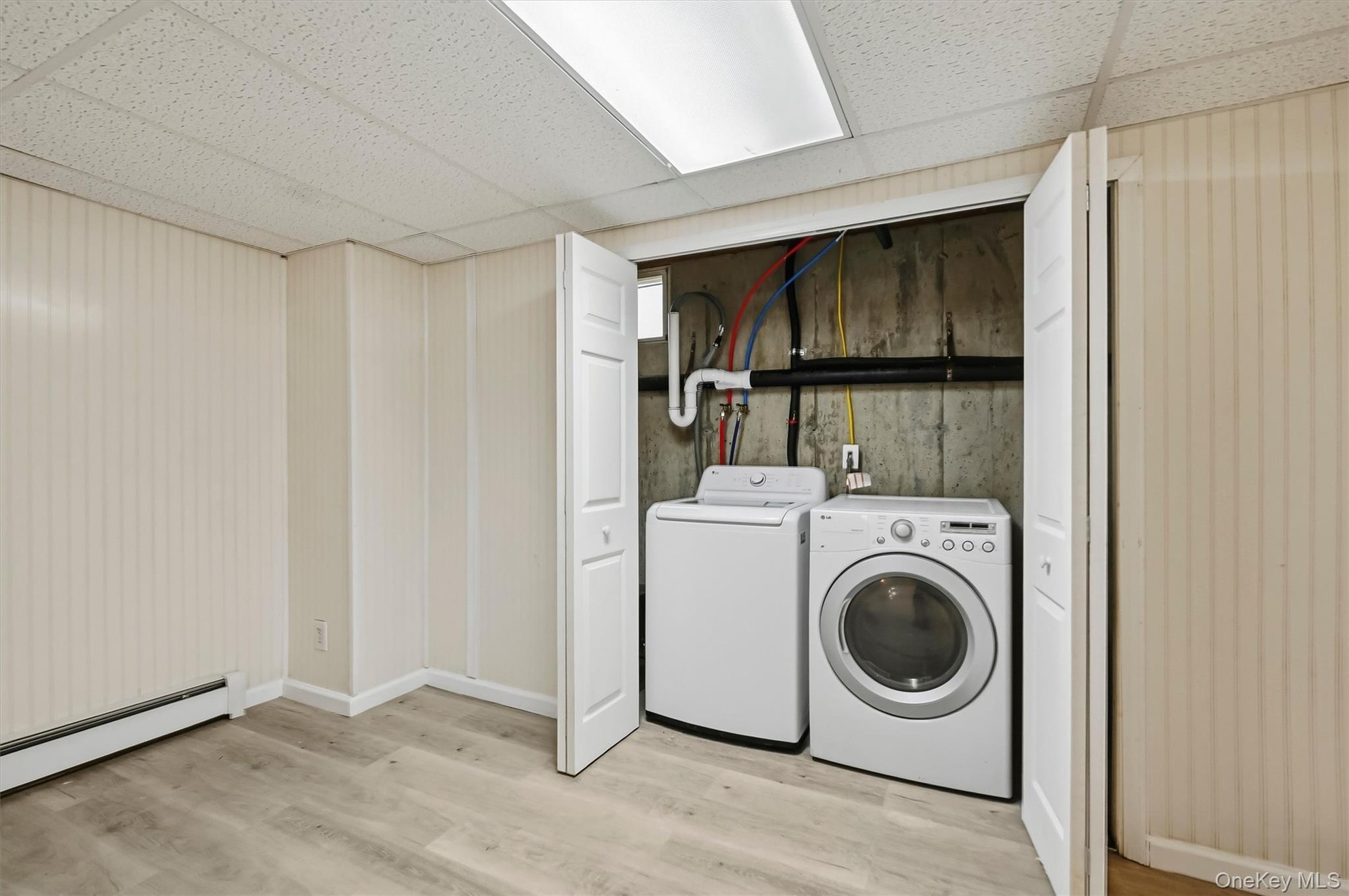 The laundry has its place, neatly tucked away while remaining easily accessible.