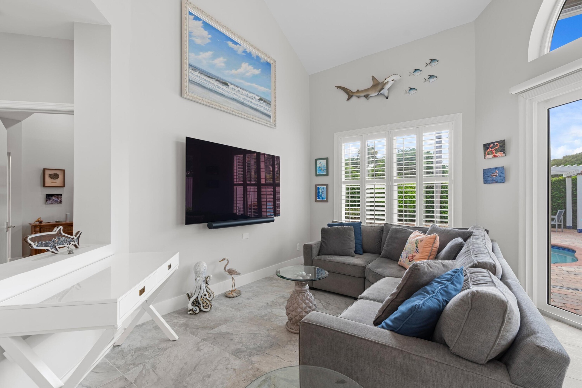 Living area with sliding glass door to pool and patio