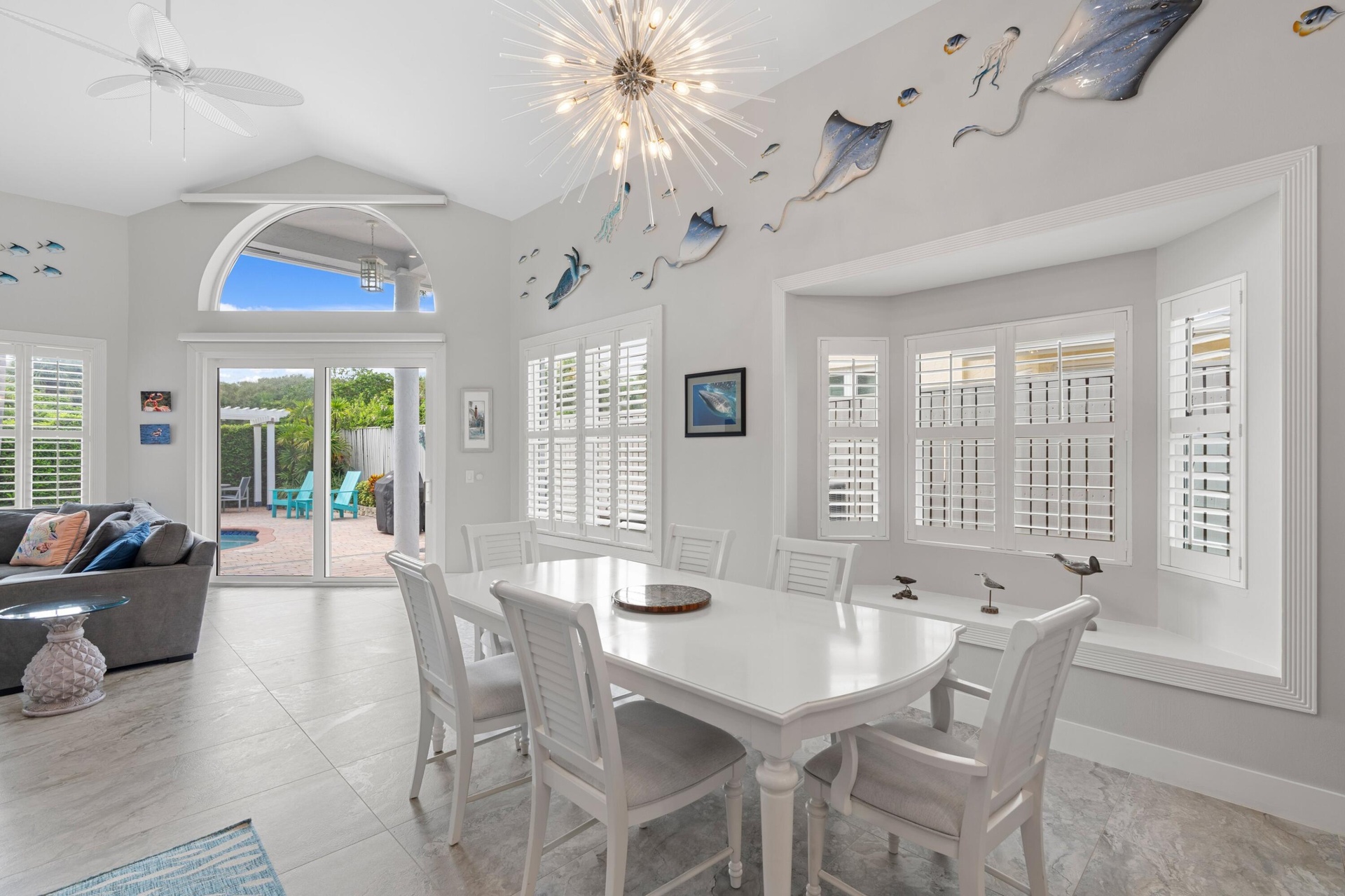 Plantation shutters & Hunter Douglas Shades throughout