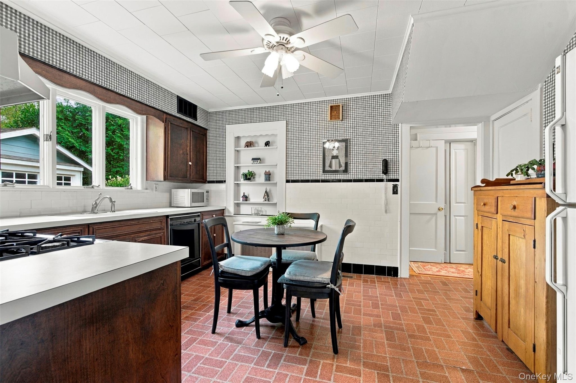 Triple windows over the sink and ample counter space.