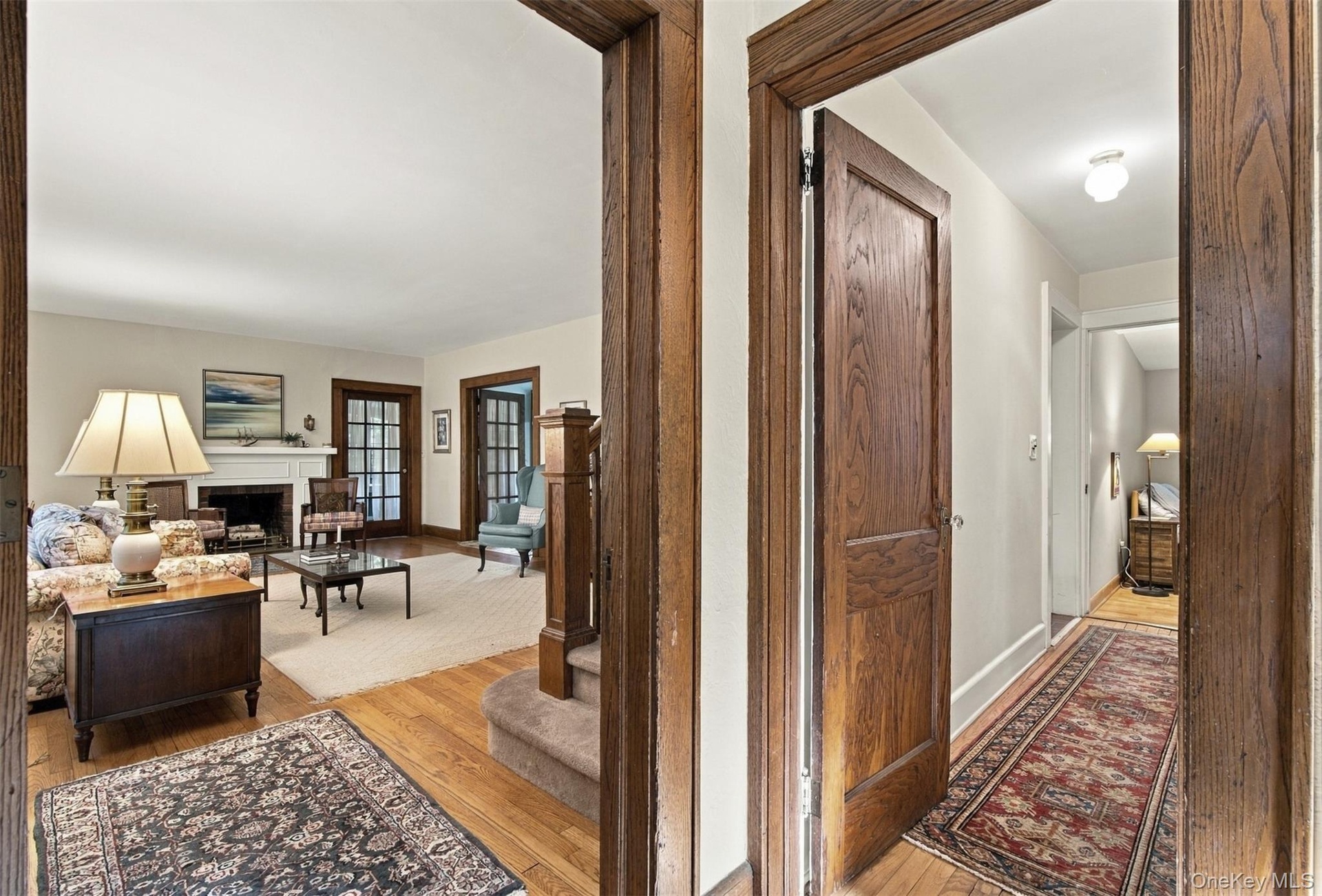 Entrance to the living room (left) and hallway entrance to the 1st floor bedroom (right).