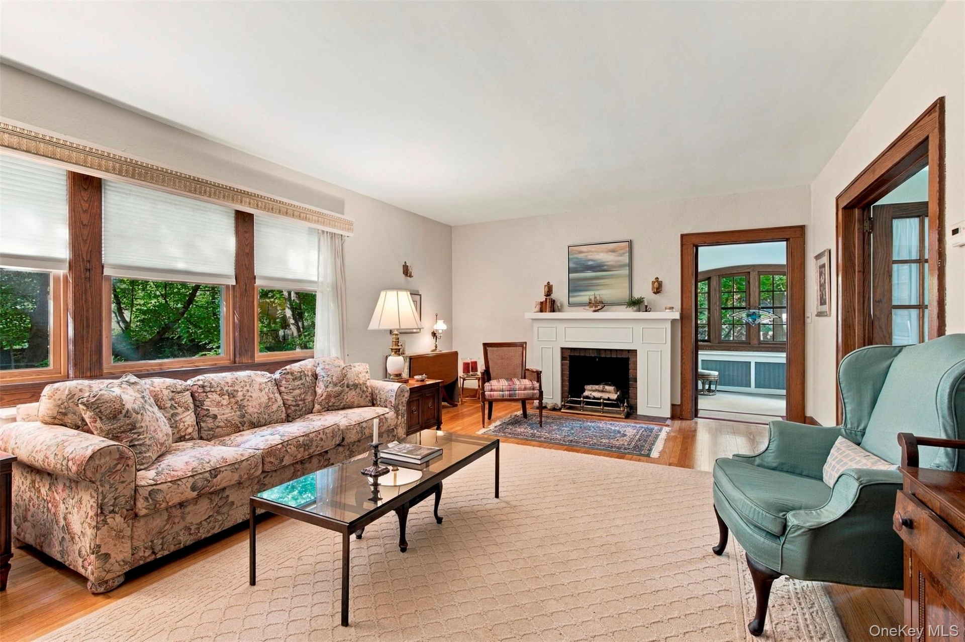 Spacious Living Room with beautiful wood-burning fireplace.