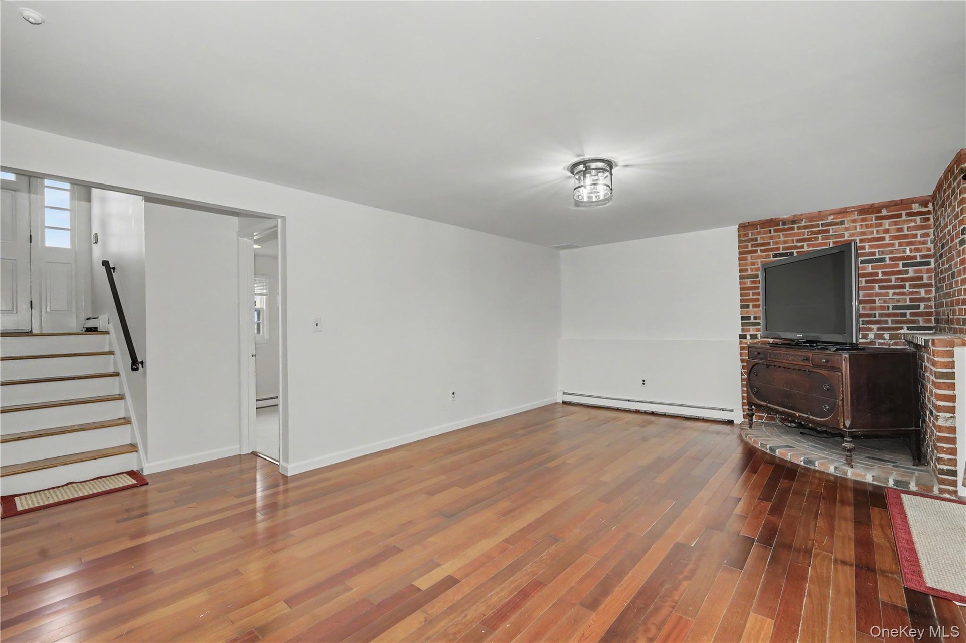 Huge family room with bricked platform for woodburning stove