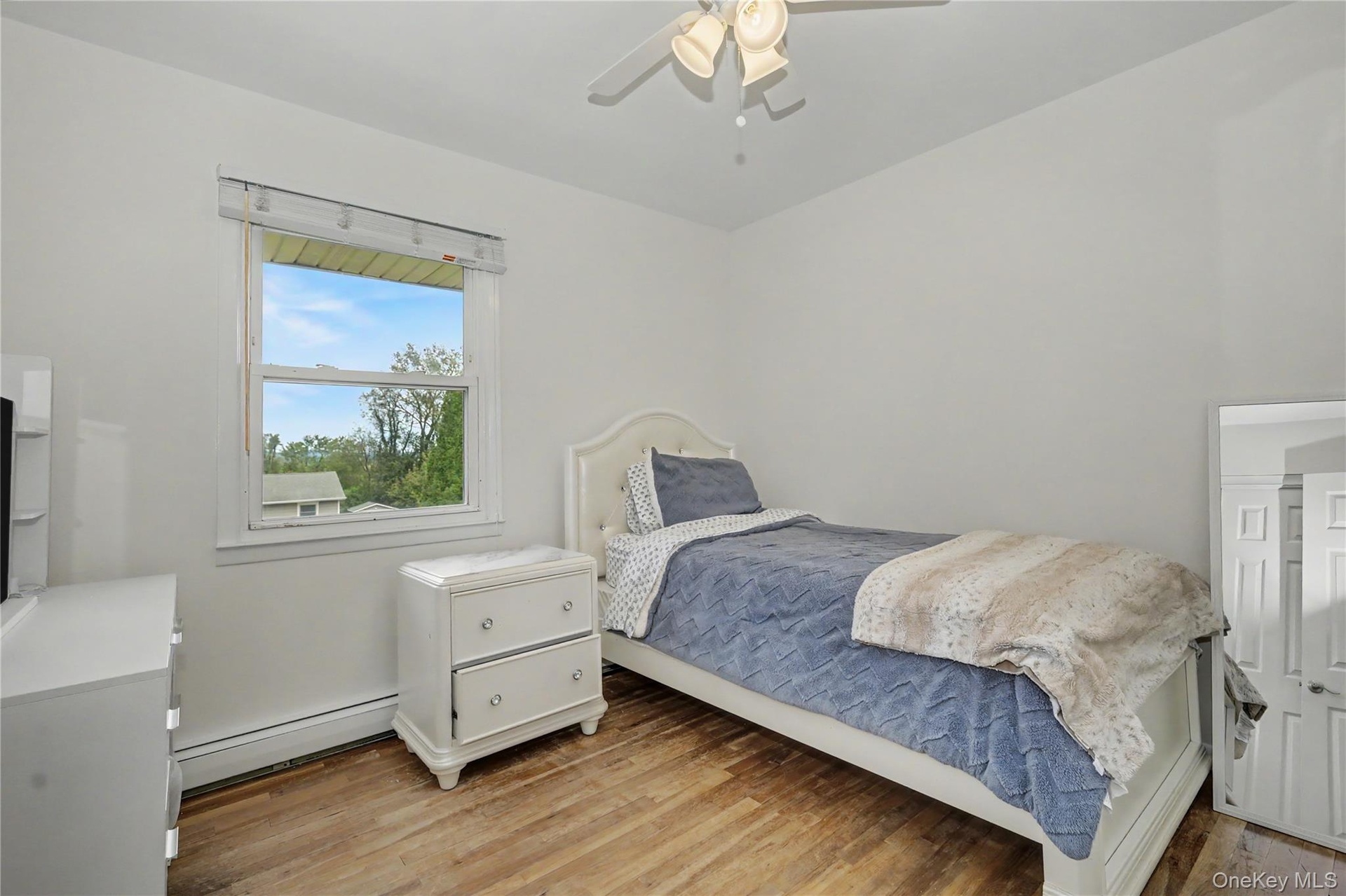 Second amply sized bedroom with great natural light and ceiling fan