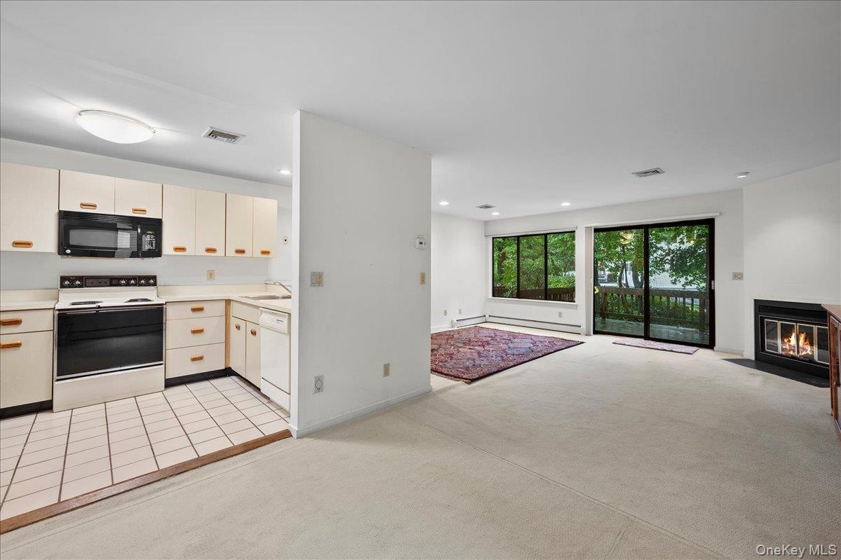 View from the dinning area looking into the kitchen and living room