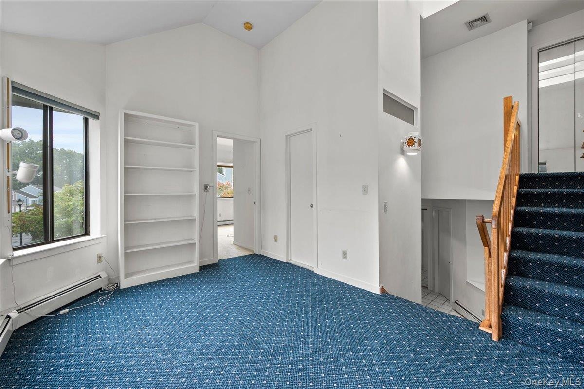 View from the den/family room, a few steps lead down to the kitchen, with a laundry area upstairs