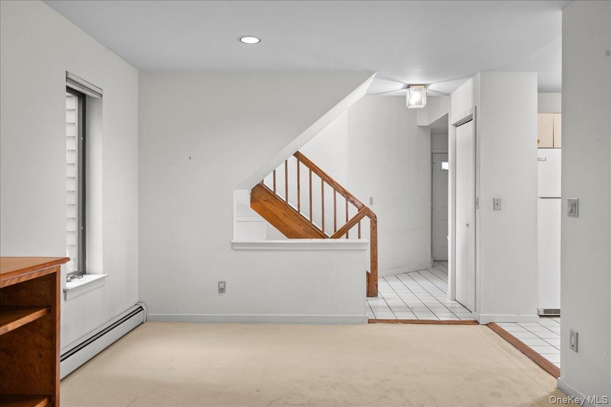 View of dining area with stairs leading to the second floor