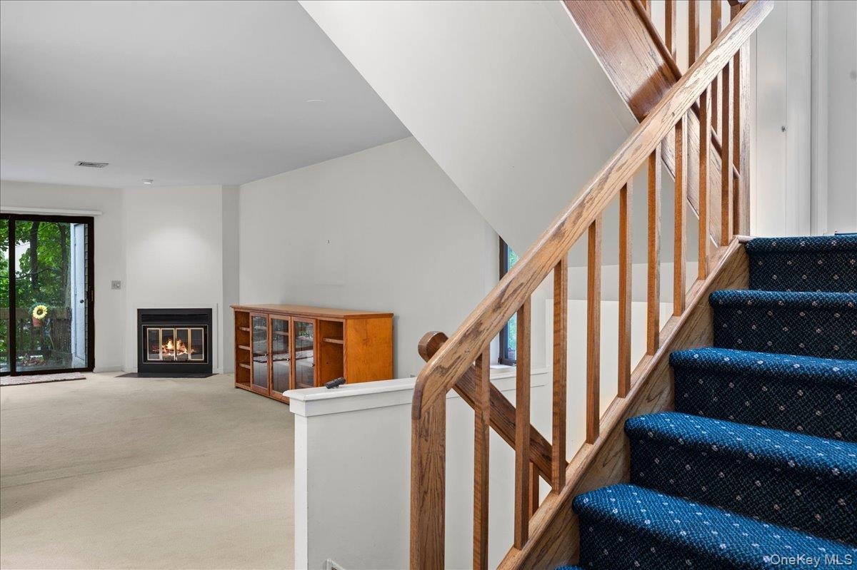 View from the front door looking into the living room and stairs to the second level