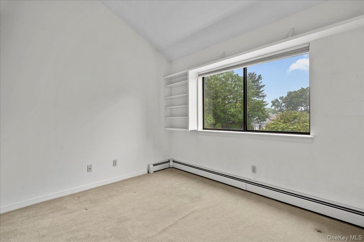 View from wall-to-wall closet in the bedroom.