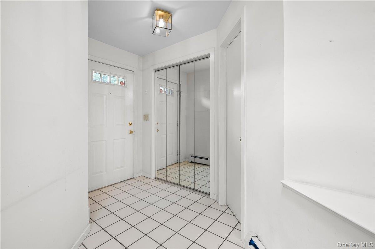 View that looks onto the front door and first floor half bath
