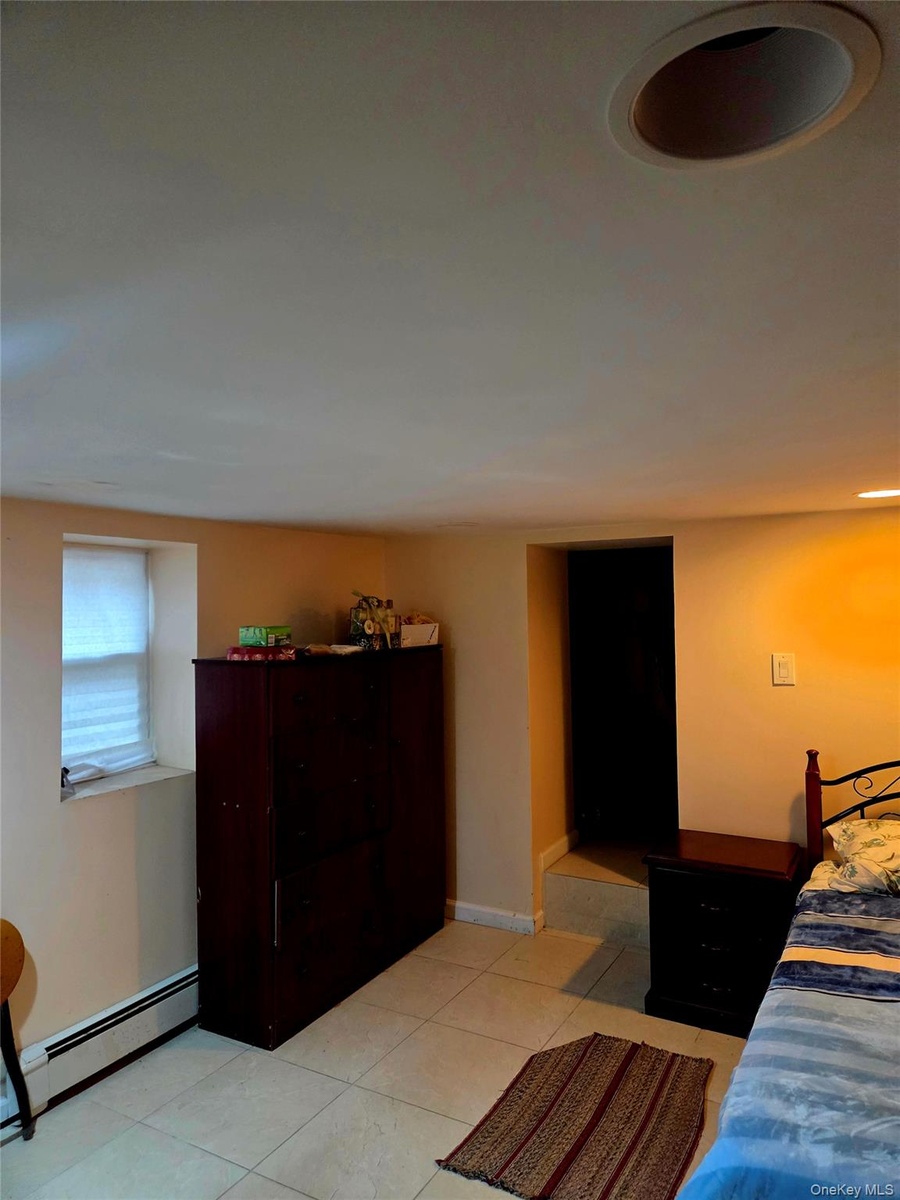 Large Basement Bedroom with an extra storage room
