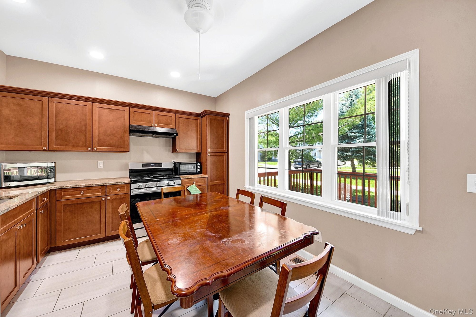 Large eat-in kitchen with hardwood cabinets, granite counter tops and stainless steel appliances