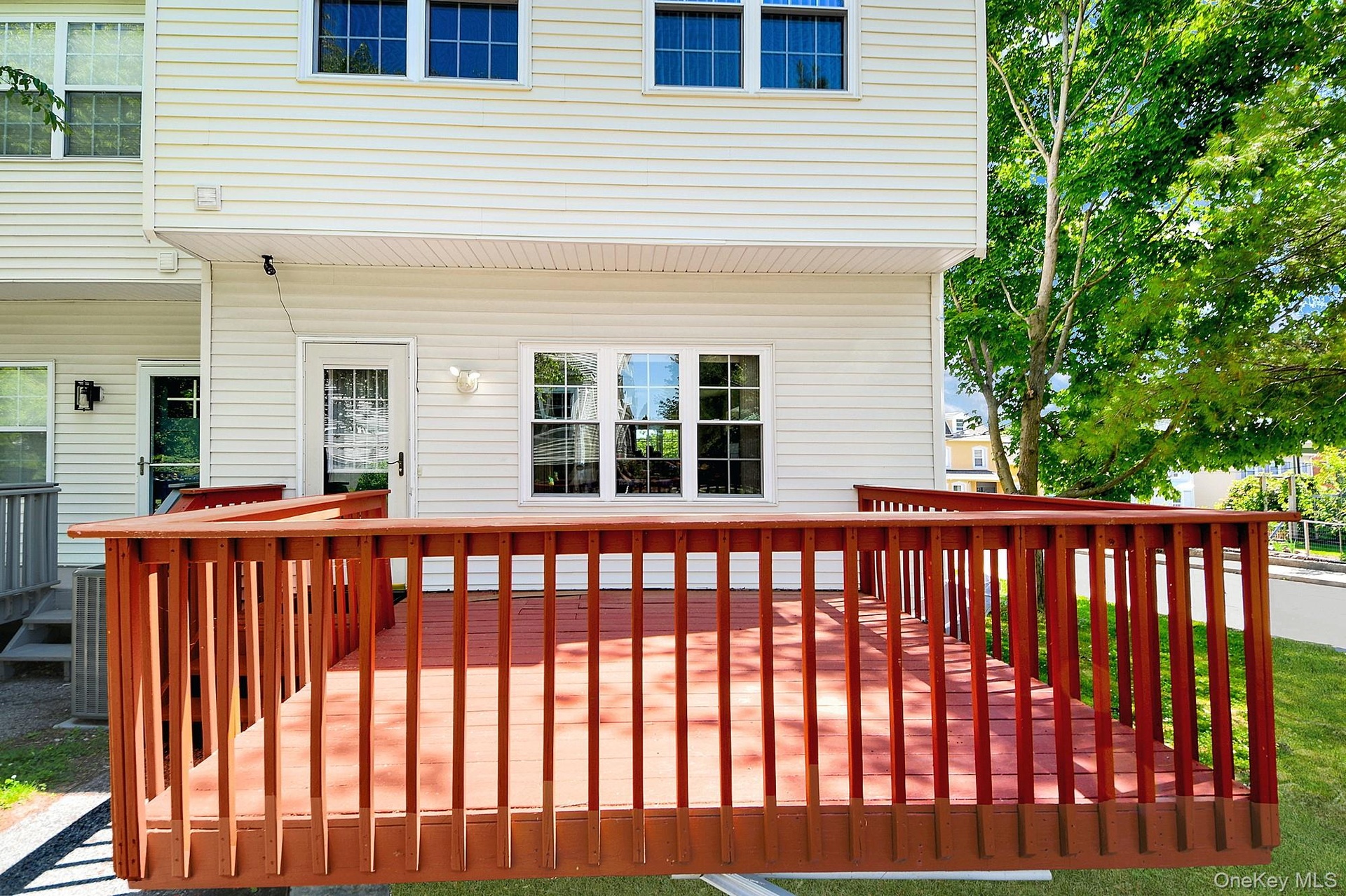 Large wooden deck off the kitchen where you can grill and dine al fresco
