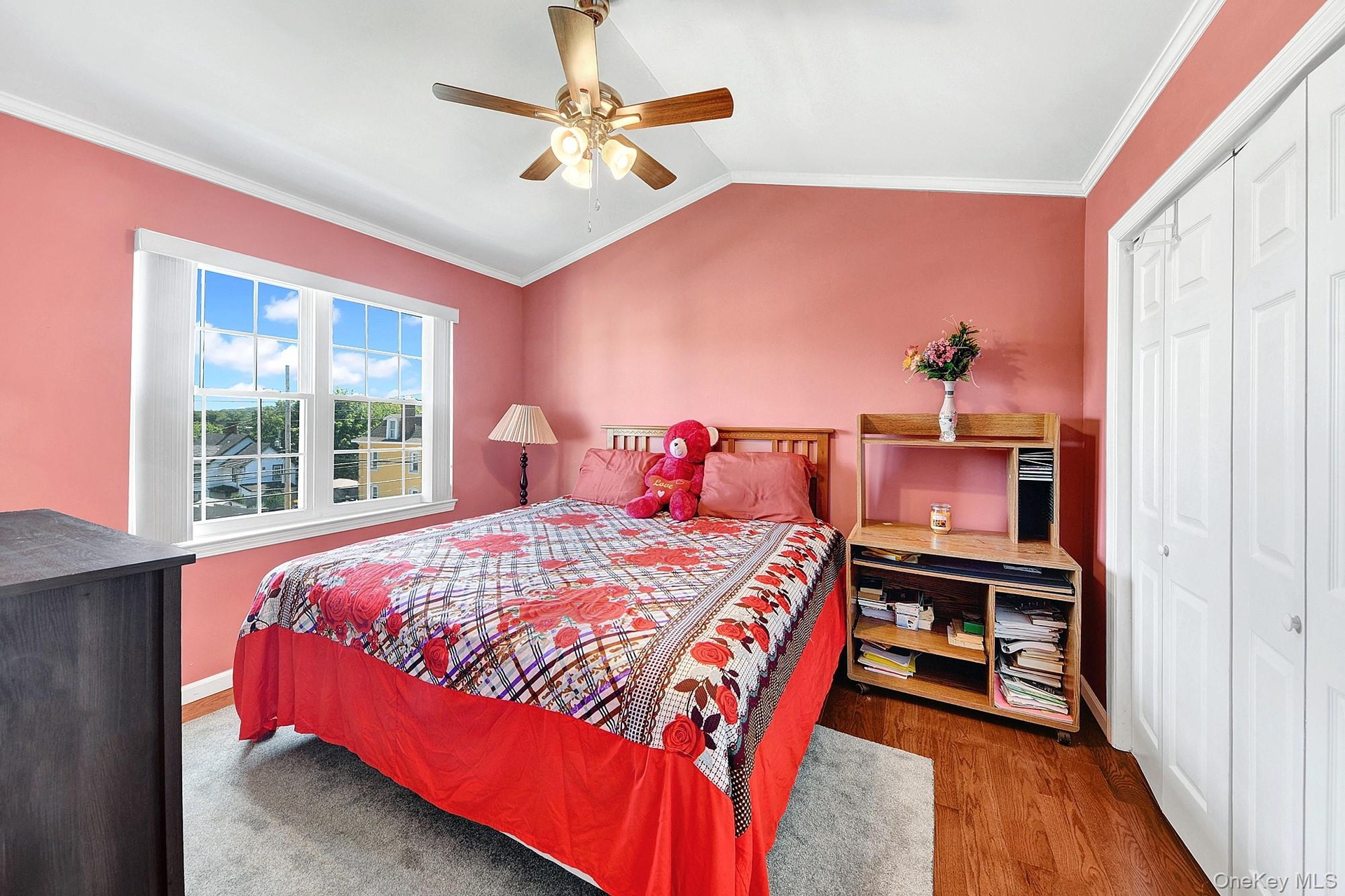 Large second bedroom with high ceilings, big windows and hardwood floors