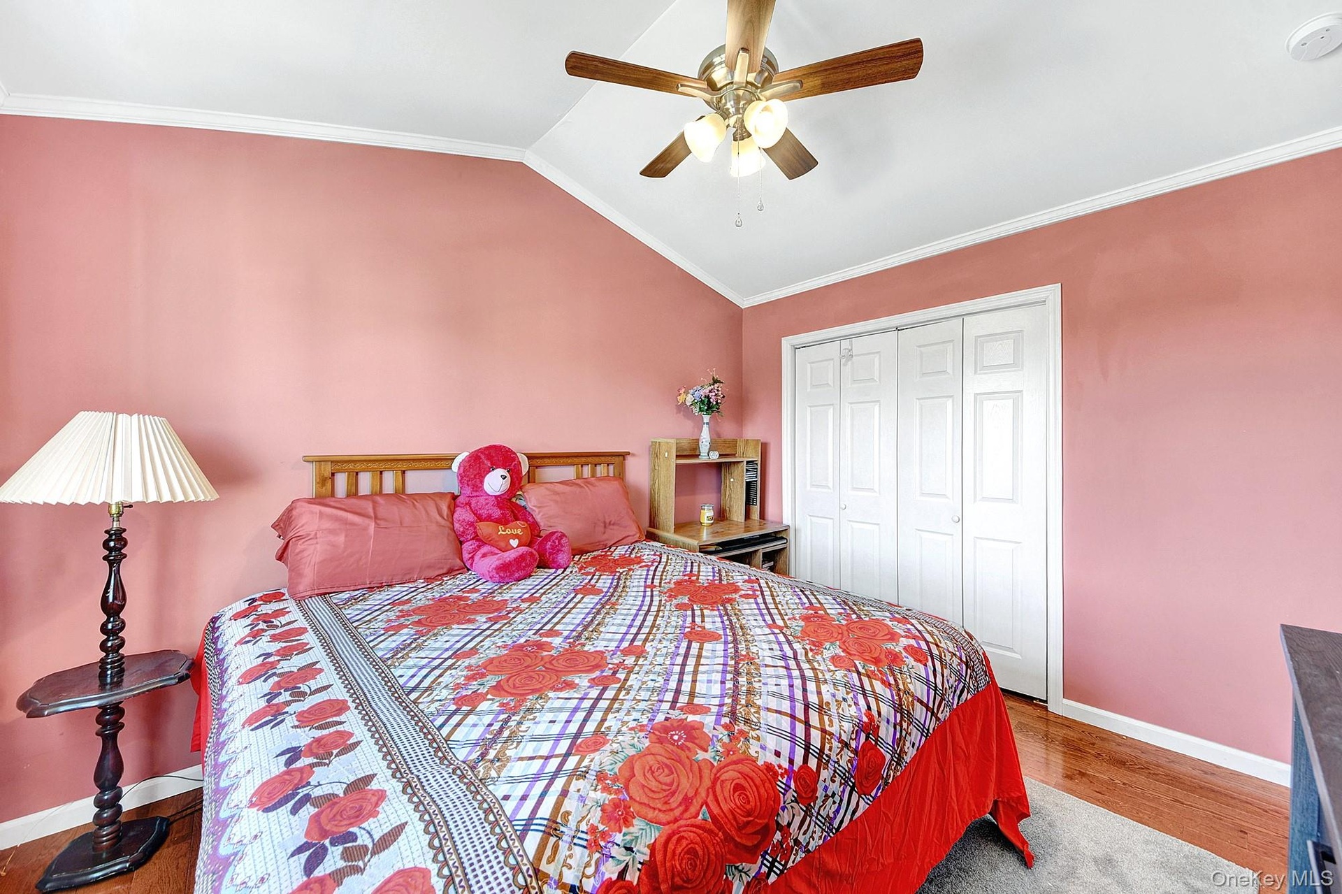 Large second bedroom with high ceilings, big windows and hardwood floors