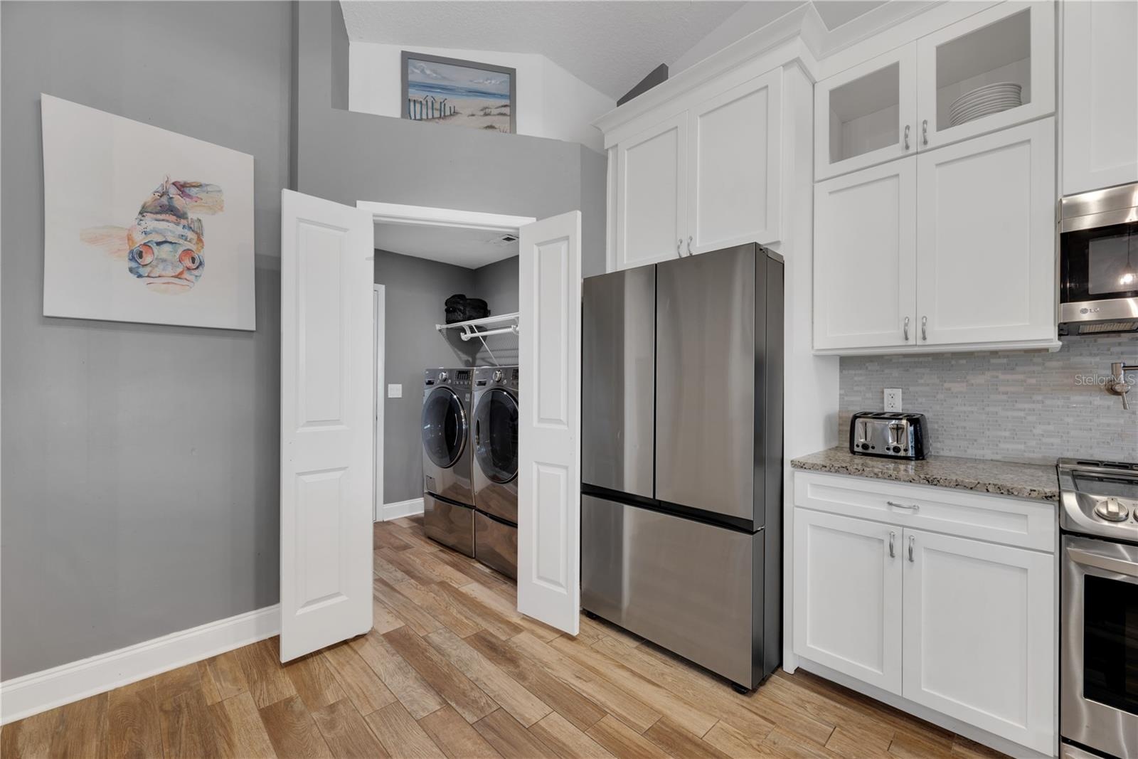 The double doors in the kitchen open to an inside laundry and garage access.