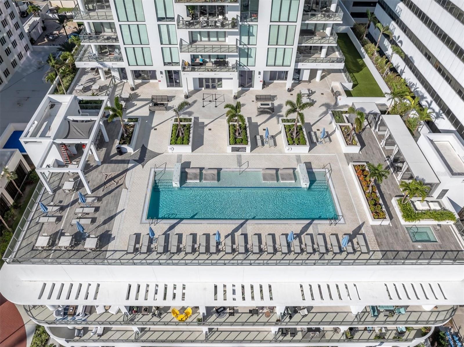 Serene pool deck water feature area overlooking Tampa Bay.
