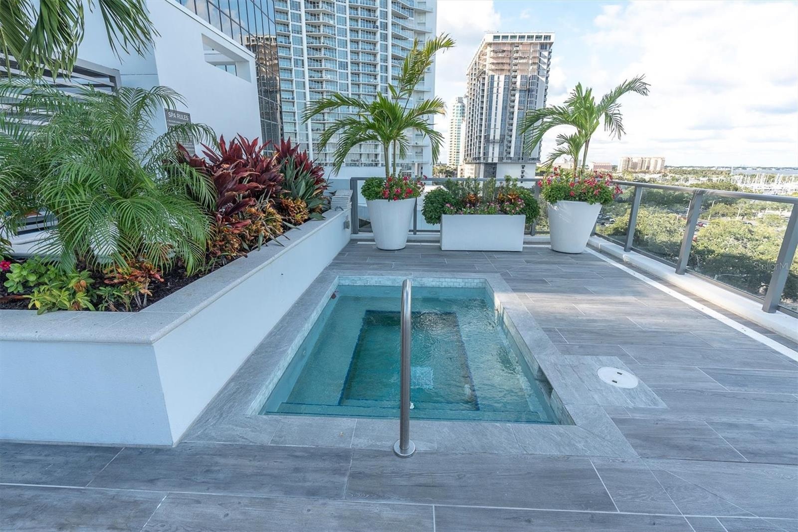 Heated pool spa surrounded by lounge deck.