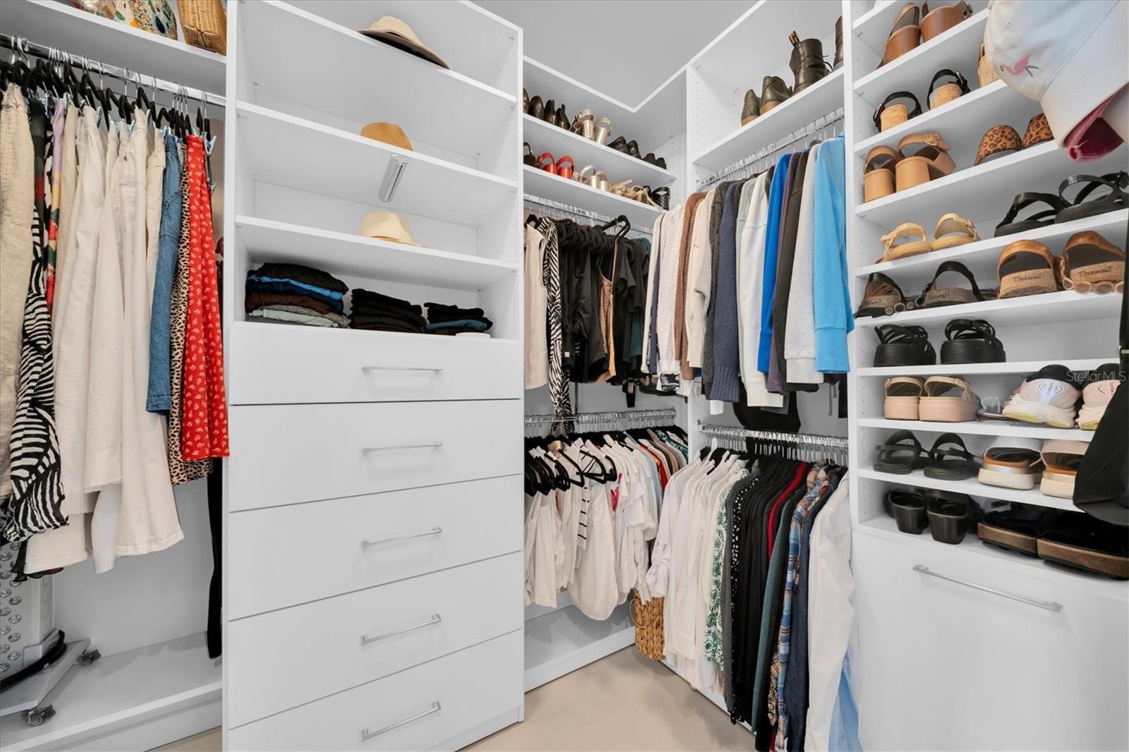 Custom walk-in closet with built-in shelving.