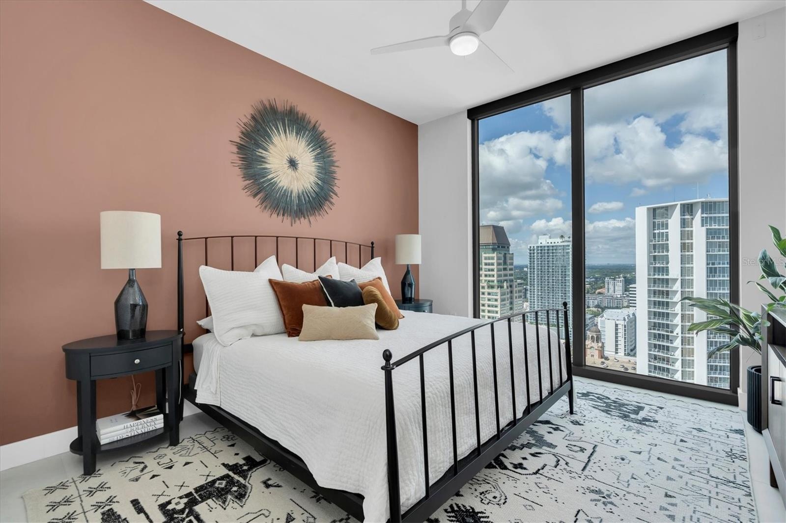 Spacious bedroom suite with high ceilings.