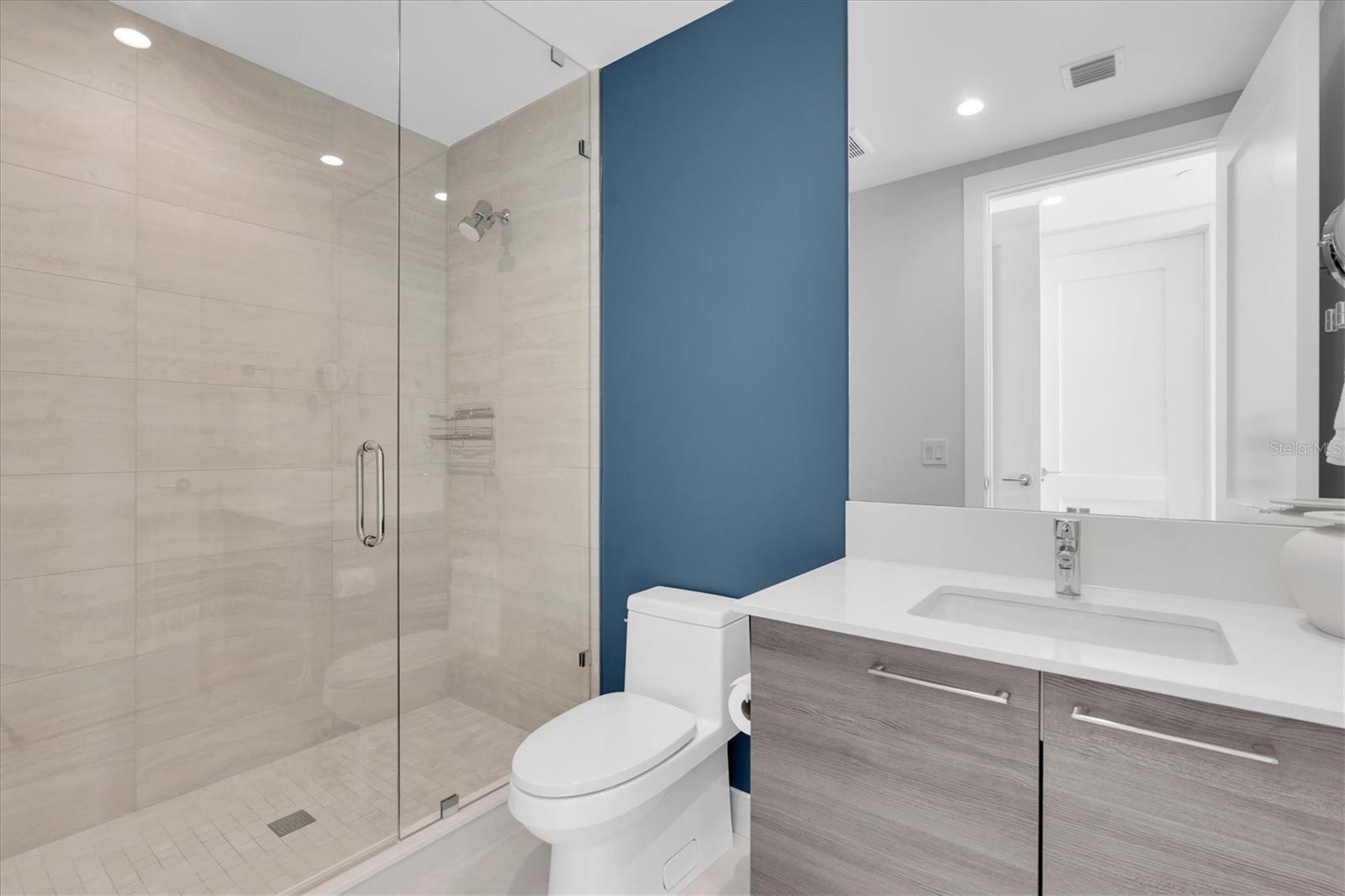 Modern full bathroom guest ensuite with premium fixtures.