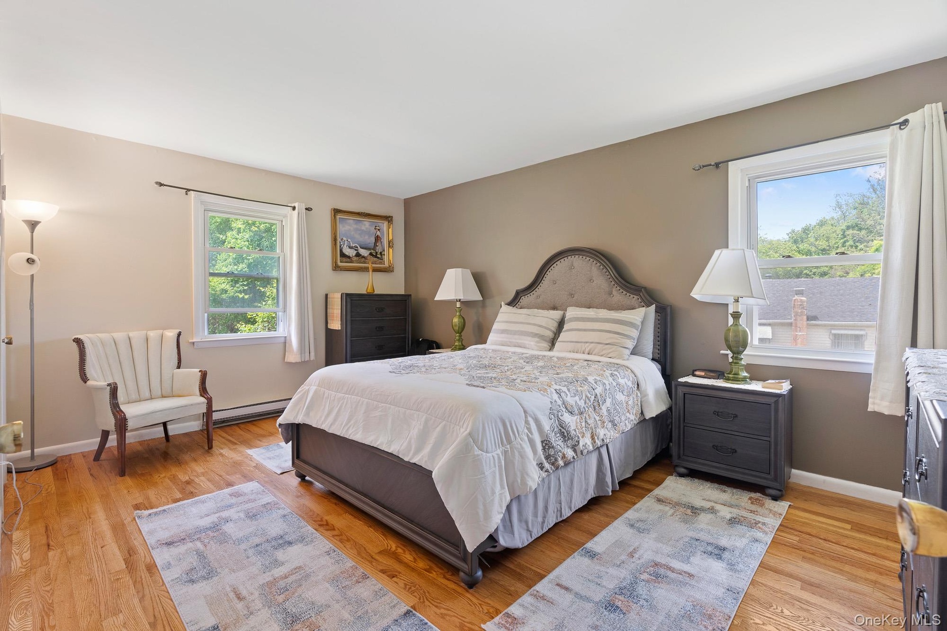 Bedroom with light wood-type flooring and baseboards