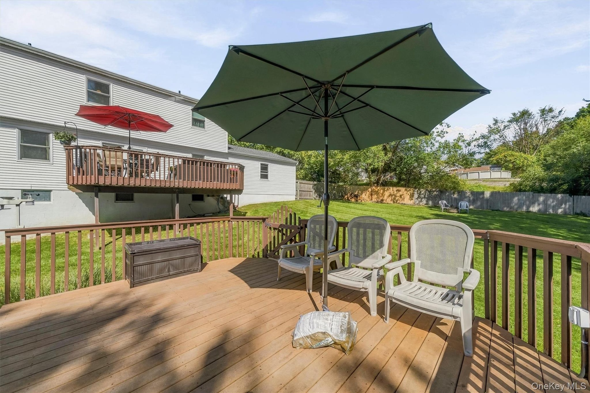 Expansive wood deck with a full railing system