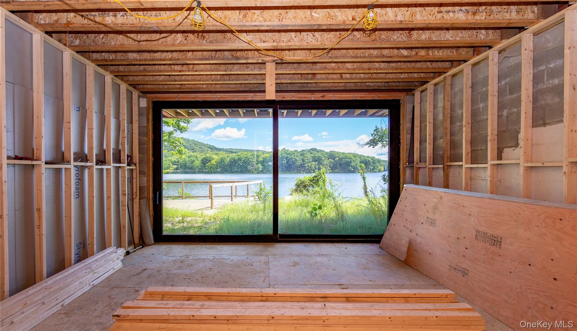 Designed to include a large family room with sliding glass doors opening directly to the front deck, surrounding yard and waterfront.