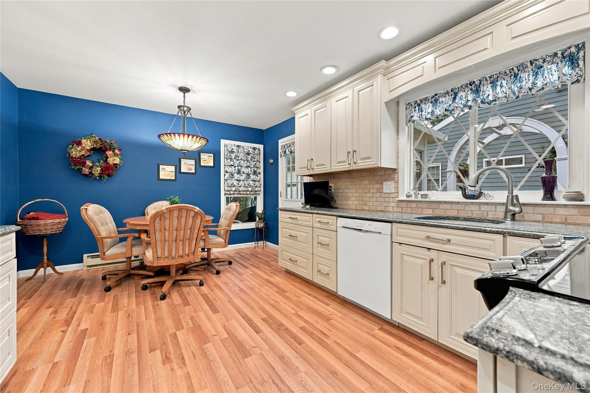 Kitchen leads you out to Sunroom and Patio for grilling.
