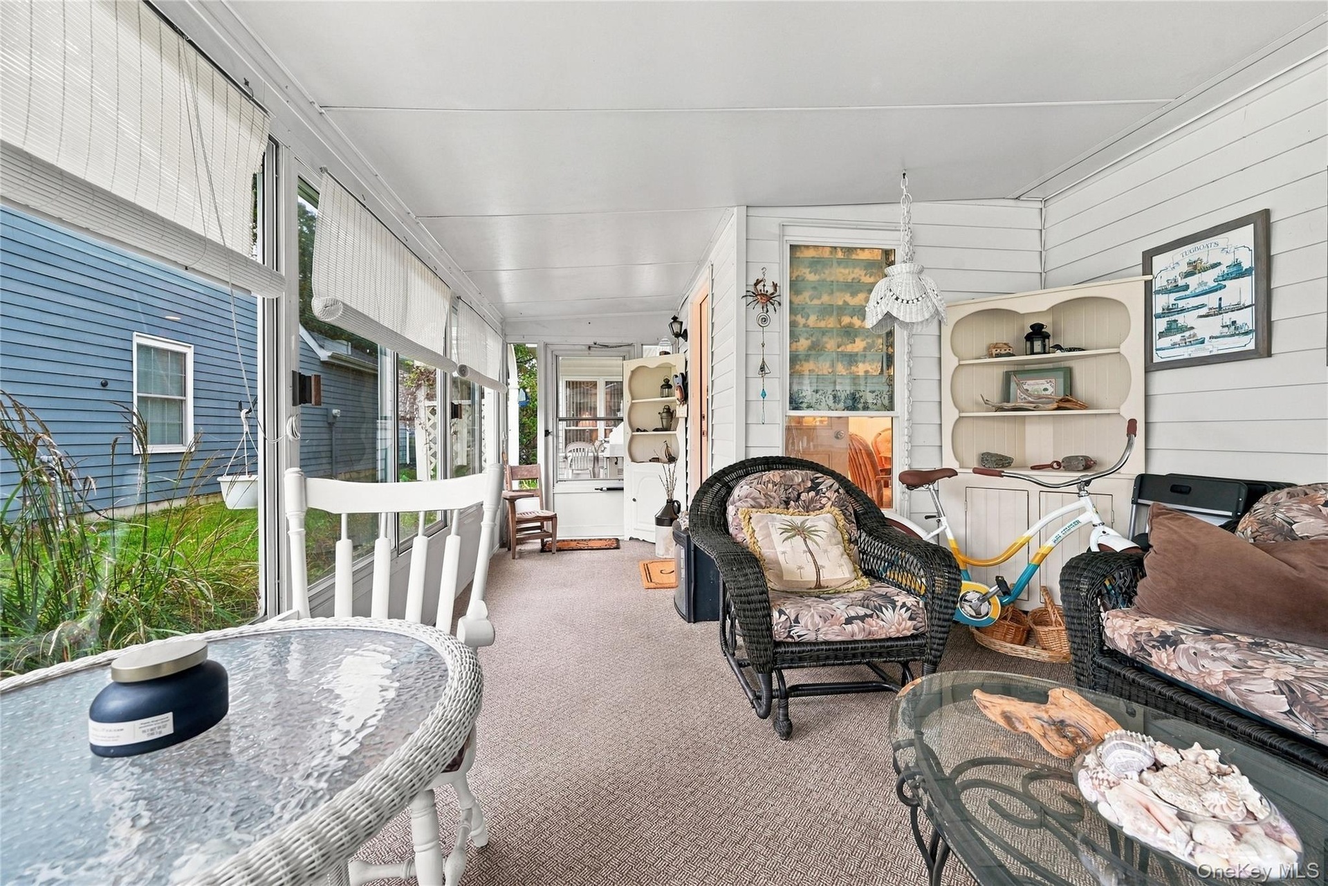 Enjoy your days relaxing overlooking gardens from walls of windows in sunroom.