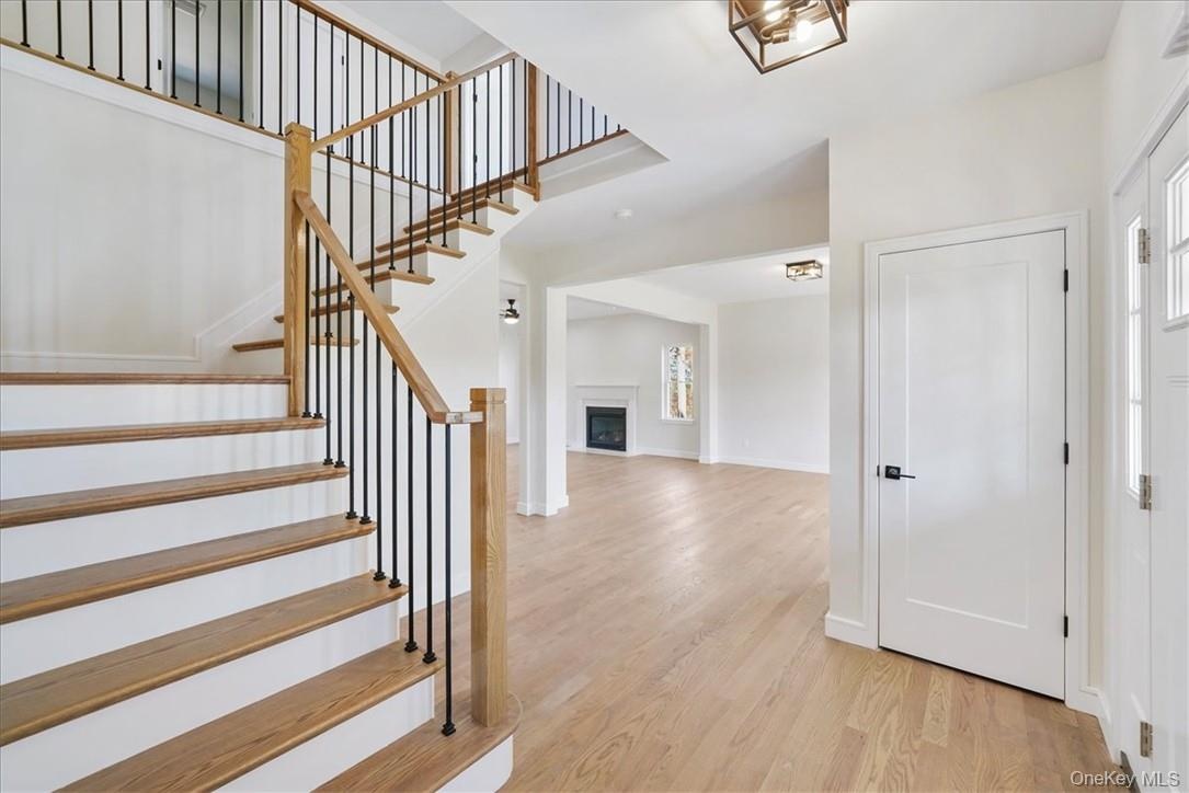 Foyer entrance featuring light hardwood / wood-style floors