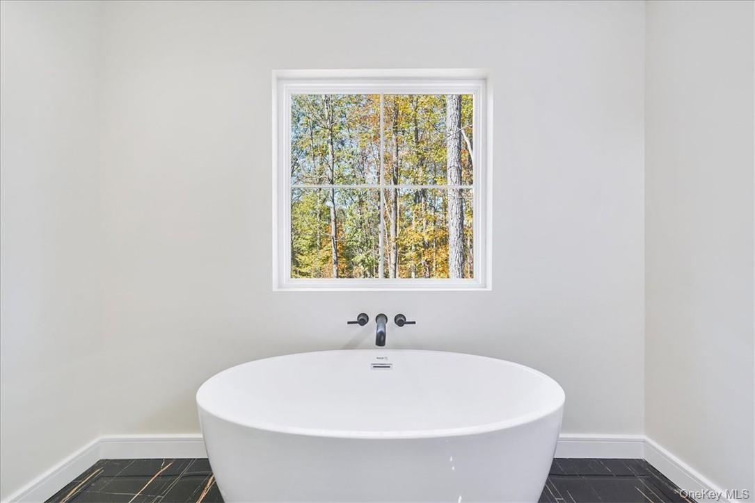 Bathroom with a washtub
