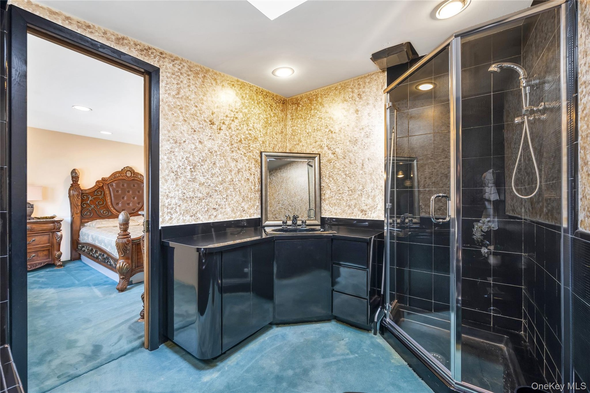 Ensuite bathroom with vanity, a stall shower, recessed lighting, and concrete floors
