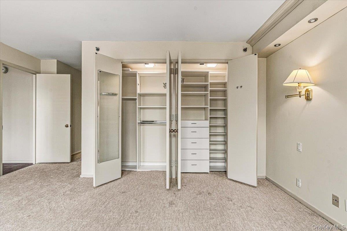 Primary Bedroom Closet with Custom Closet System