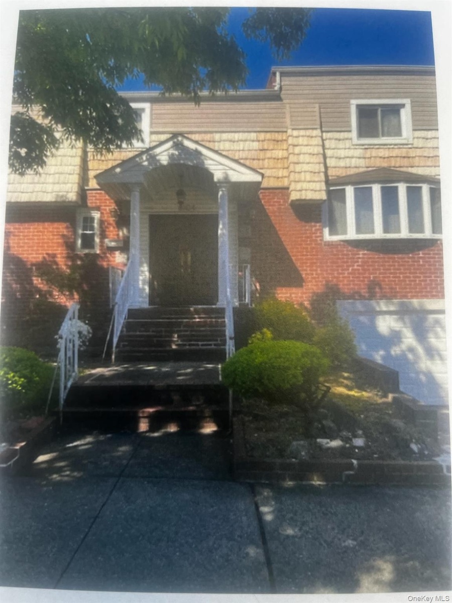 Brick facade with shingle siding accents