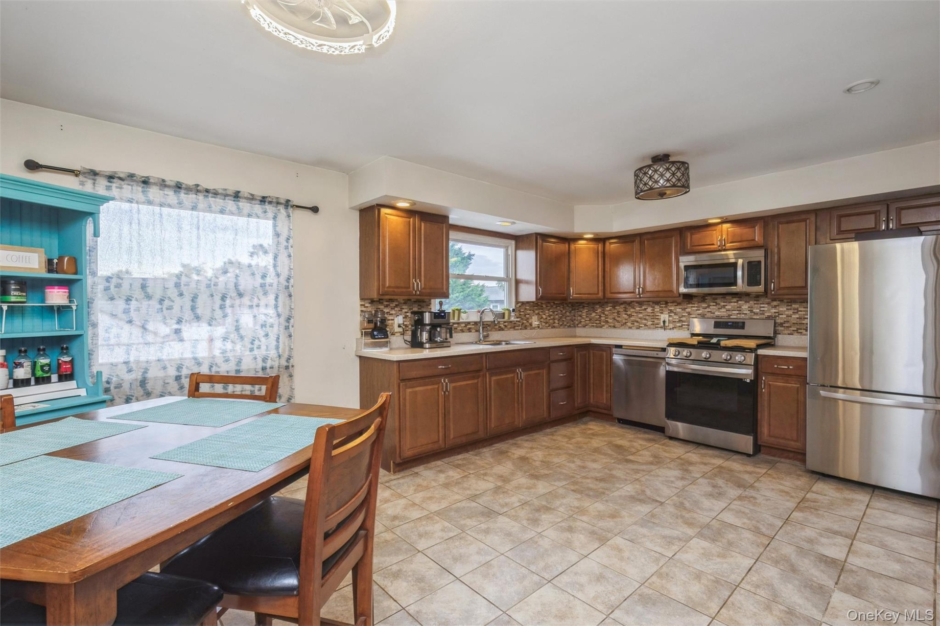 Second floor large kitchen with new stainless steel appliances and huge pantry room.