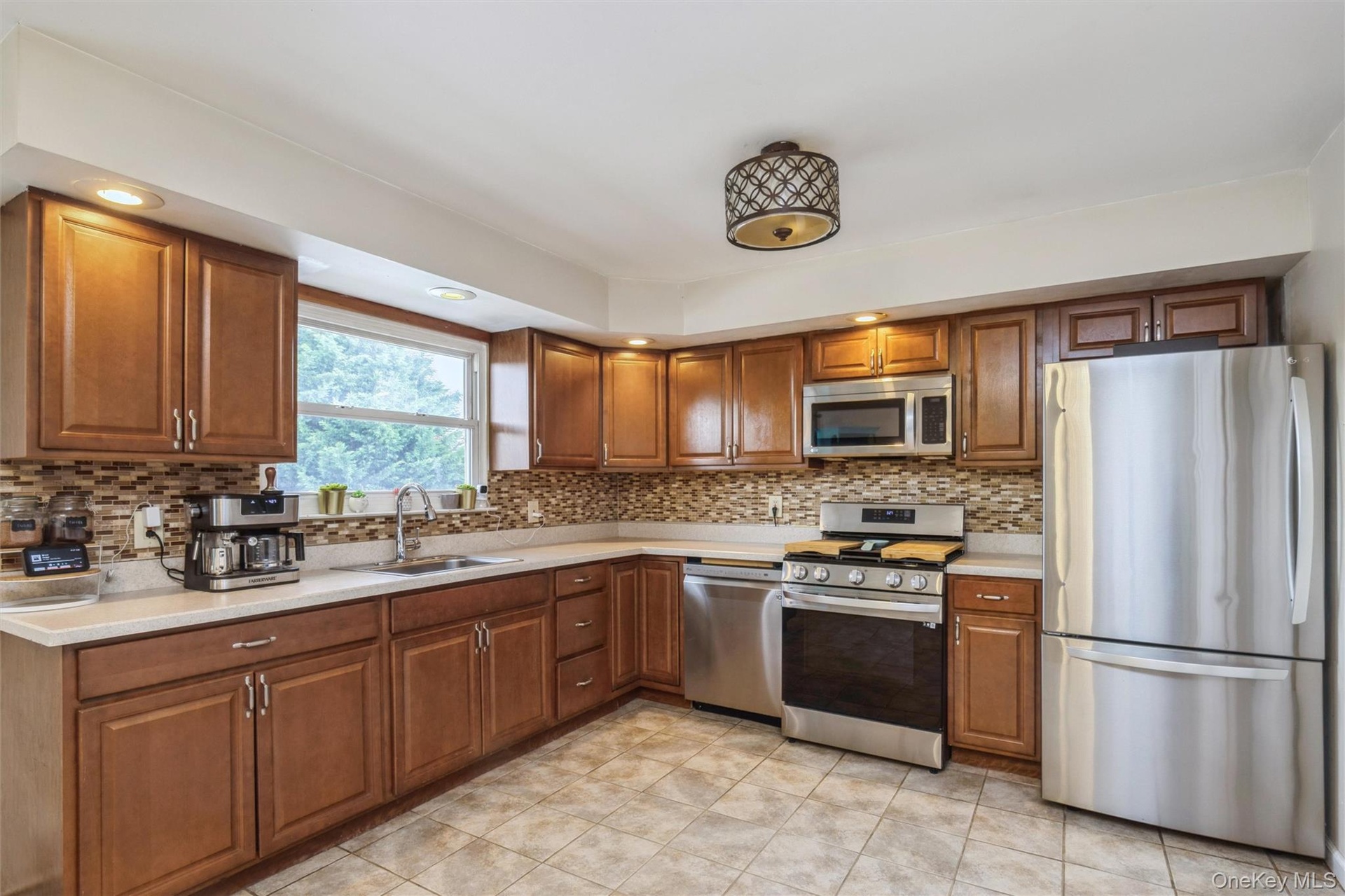 Second floor large kitchen with new stainless steel appliances and huge pantry room.