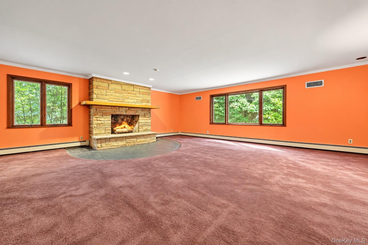 Stone fireplace with raised hearth