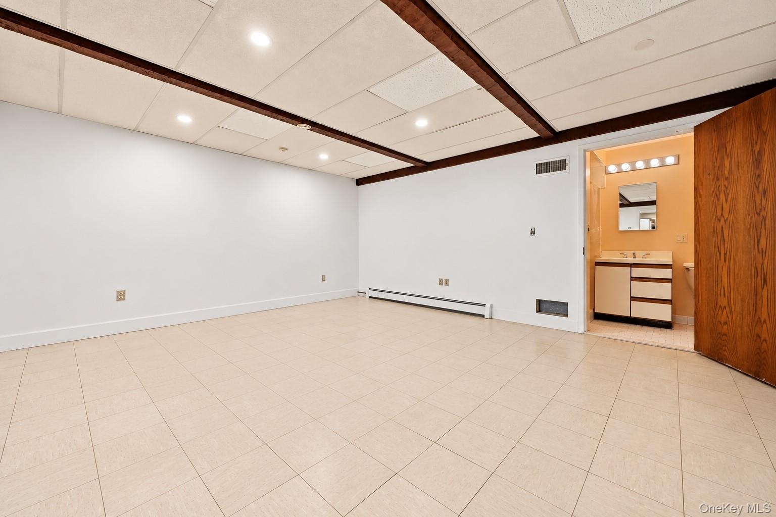 Another view of the office with private bath.  Extraneous objects removed.