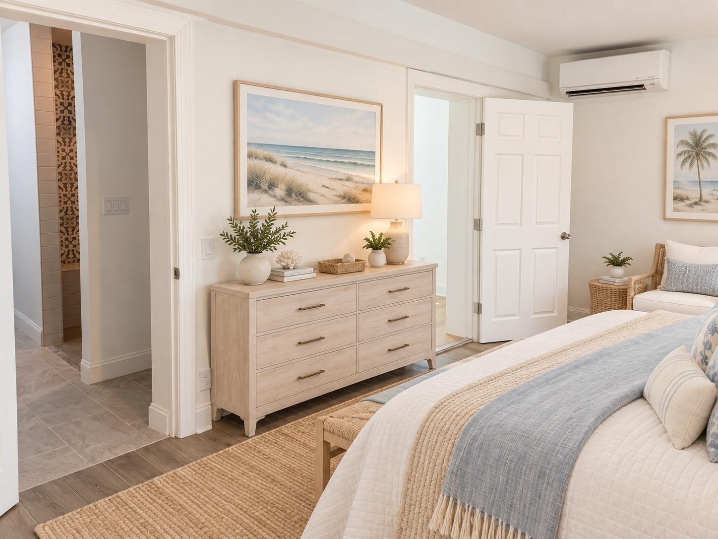 Primary bedroom with entrance to large walk-in closet and primary bath